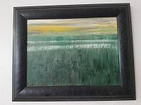 Full view of the framed landscape painting showing horizontal bands of green, white, and yellow colors with reflections and textured brush strokes, signed in lower left corner.