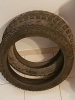 Two Heidenau dirt bike tires stacked inside each other showing tread depth and sidewalls.