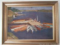 Full view of the framed vintage painting showing racing boats docked at a lake with people on the pier and distant landscape