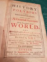 Photo of book's title page showing the full printed text with red and black ink including the title, translator's name, and publisher details with year MDXCIII (1693)