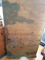 Full view of the lower part of the scroll showing figures in traditional robes under a large tree and natural scenery