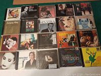 Overview of the 20 jazz and mix music CDs arranged on surface showing cover art and titles