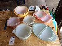 All items arranged on plywood, showing full lot of casserole dishes and mixing bowls