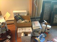 Wide shot of all boxed and loose items, including kitchen appliances, kitchen tools, and accessories.