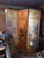 Front view of the three-panel hand painted room divider showing floral and landscape paintings on wooden panels with visible wear.