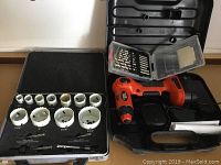 Overall lot contents: cordless drill, drill bit set and hole saw kit