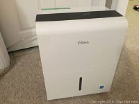 Full front view of the white Classic dehumidifier on carpet