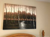 Large stretched canvas print depicting birch trees with textured brown and white tones hanging on a wall.