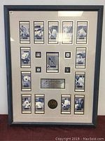 Front view of framed limited edition commemorative with multiple photos and plaques