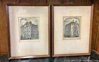 Front view of two vintage framed Toronto scene prints side by side on a wooden surface