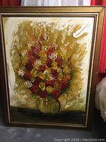 Full front view of the original oil painting in frame showing multicolored flowers in a vase on textured background.