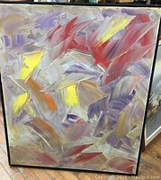 Full view of large abstract oil painting with varied colors and dynamic brush strokes signed at lower left corner.