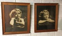 Both framed Cupid prints hung side by side showing full frames and images