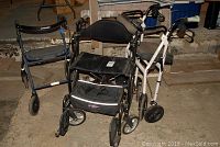Three walkers shown together. Central is the Airgo Fusion 2-in-1 walker/wheelchair with padded seat and backrest, on right is a white-frame Airgo walker, left is a simpler blue Dotomite walker.