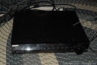 Front view of the Sony DVD disc changer HCD HDX686W showing buttons, display, and disc tray.