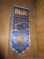 Blue nylon banner with 'Labatt Blue' near top and multiple NHL team logos beneath. Bottom features NHL shield and sponsorship text.