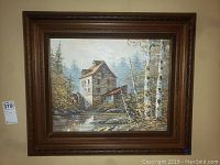 Full frontal view of framed painting showing water mill landscape