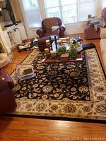 Full view of the rectangular rug placed in living room with furniture around