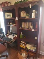 Front view of both bookcases side by side, one with desk section open, showing overall size, finish and condition