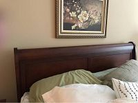 Front view of wooden headboard against wall