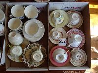 Overall lot of six cup and saucer sets arranged in two cardboard boxes