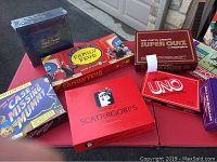 Overview of board games including Trivial Pursuit sealed, Family Feud, Scattergories, Case of Missing Mummy