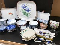 Full lot display showing the various plates, bowls, platters, condiment dishes, and chopstick rests