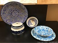 View of collection including large Turkish design plate, lidded handled bowl, abstract blue and white pot, and three splatterware pieces including large plate and two bowls.