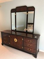 Front view of dresser with attached tri-fold mirror