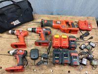 Overview of entire set: bag, saw, drills, batteries, chargers