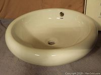 Photo showing the Rodam white round vessel sink with overflow and glossy finish.