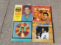 Four Elvis Presley vinyl records including Pot Luck Elvis, Elvis Golden Records, Elvis Golden Records Volume 3, and The 68th Comeback Special.