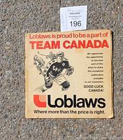 Front cover of 1972 Team Canada hockey program sponsored by Loblaws showing an illustration of hockey players and text praising Team Canada.