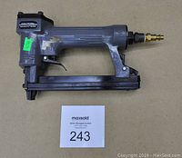 Side profile of the 1/2 inch Crown Air Stapler showing the overall body and air hose connection.