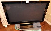Front view of Panasonic Viera 50" plasma TV on protective mat showing screen, bezel, and base
