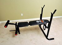 Full side view of York 7500 exercise bench showing padded seat and leg rollers