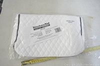 KitchenAid mixer cover in original packaging with label showing product details and compatibility.