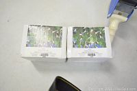 Two white boxes of Pearl Lights sets shown on a floor surface.