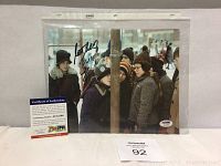 Signed color photo from A Christmas Story with visible autograph and Certificate of Authenticity with PSA/DNA branding and certification number AC12596.