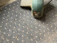 Close-up photo of the Black and Decker 10 inch weed trimmer showing branding and blade guard