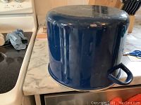 Large blue San Ignacio stock pot showing side with handle.