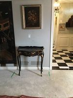 Wide shot of painting mounted above the console table