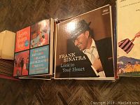 Image of several vinyl record albums including Frank Sinatra 'Look to Your Heart' and Masters of Modern Music album covers