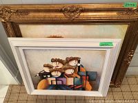 Two framed paintings stacked together, showing abstract musicians. One in a white frame (26x22 inches).