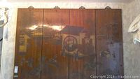 Front view of four wooden panels displaying embossed Asian garden scene