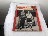 Front cover of the 1964 hockey magazine showing Coach Milt Schmidt and Captain Leo Boivin in Boston Bruins uniforms.