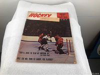 Photo of the 1965 Hockey magazine cover showing players in action on the ice with goalie near net.