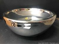 Full view of the silver mercury glass bowl showing reflective surface and rounded shape.