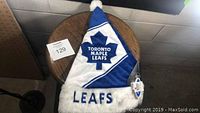 Full view of the Toronto Maple Leafs blue and white plush Christmas hat with logo and "LEAFS" embroidery on skin fur trim.