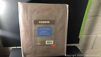 Packaged new Cannon cotton blanket in brown with product label visible